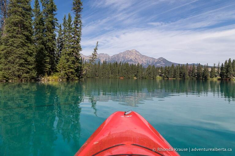 Kayak on Lac Beauvert with Pyramid Mountain in the background.